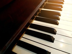 Piano, keyboard piano, side view of instrument musical tool. Background.