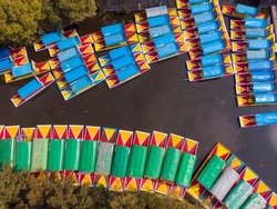 Aerial Drone Shot of Colorful Boats in Xochimilco. Tours by cannels with floating gardens in Mexico City CDMX, Mexico