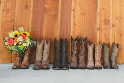 Brown cowboy boots bridesmaids with bouquet