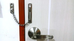 A door chain, security chain, or securitydoor chain consists of a small chainattached to the door frame, which attaches to a track on the door for security purposes