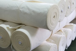 roll of white fabric for cutting