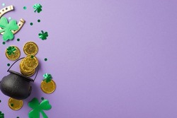Top view photo of st patrick's day decorations pot with gold coins green clovers horseshoe and trefoil shaped confetti on isolated pastel lilac background with copyspace