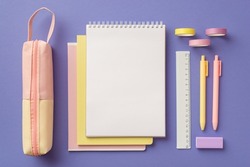 School supplies concept. Top view photo of colorful stationery pink pencil-case stack of reminders pens ruler eraser and adhesive tape on isolated purple background with blank space