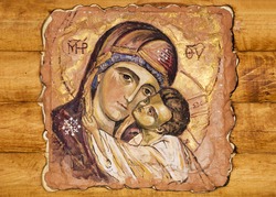 a small icon painted on a wood