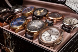storage black leather box with collection of men wrist watches