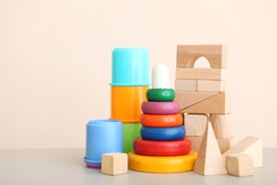 Set of different children's toys on a colored background. A place to insert text, minimalism. Baby background.
