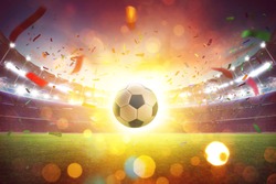 Floating soccer ball at the football stadium with smoke and bokeh abstract  background.