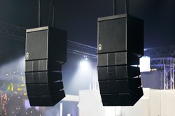 Concert hall, professional acoustic system, suspended soundspeakers. Disco and party making equipment, power Hi-Fi sound high level monitors. High tech background, digital sound technologies 