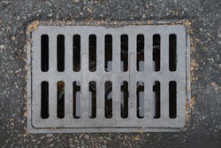 The metal cover for the drainage on the street