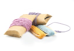 roll of colorful hemp thread on white background