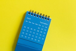 Desktop calendar for September 2022 on a yellow background