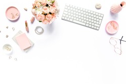 Stylized women's desk, office desk. Workspace with, laptop, bouquet roses, clipboard. Women's fashion accessories isolated on white background. Flat lay Top view