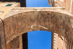 A rib bone of a whale is hanging under the della Costa arch in Verona, Italy. The legend says it will fall down if the first innocent or truthful person walks under the archway