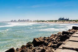 Necochea city, Buenos Aires, Argentina. View of the town skyline and the beach from the harbor pier.