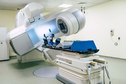 Photo of medical an advanced linear accelerator in the therapeutic oncology cancer therapy in the modern hospital laboratory