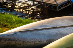 Canoe kayak laying on shore paddle recreation lake river boat float sunset beautiful summer camp