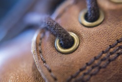 Leather shoe rivet close up