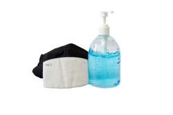 Covid-19 virus prevention travel surgical masks and hand sanitizer gel isolated on whitebackground. 