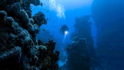 Underwater diver in deep sea dive