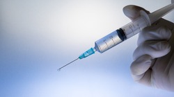 Coronavirus (COVID 19) Vaccine and syringe injection.
Close up vaccination vial dose flu shot drug needle syringe. 