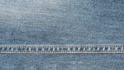Blue denim texture background.
Fabric seam jeans for fashion seamless.
top view. 