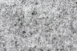 Black fiber line mat texture.
Abstract Felted fabric dark clolr gray.
White grunge cotton fabric knit heather background. 
Selective focus.
top view.