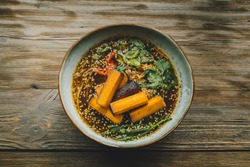 Healthy vegan food in coffee shop, Vegan Tofu Feta Cheese in soup, vegetables and plant based food 
