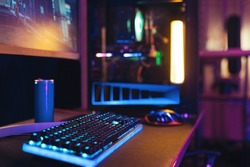 Close-up of empty gaming streaming studio equipped during first person shooter online competition. Professional setup with powerful computer, keyboard, monitor and mouse ready for online championship 
