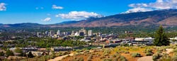 Downtown Reno skyline, Nevada, with hotels, casinos and the surrounding High Eastern Sierra foothills