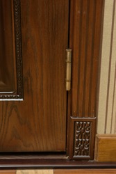 Iron loops on the brown door. Hinged accessories on the door