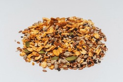mixed seeds on a light background. mix of cereals for a healthy diet on a white background. assorted cereals for granola