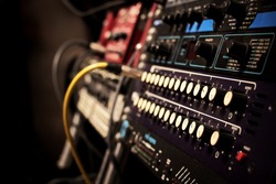 recording studio gears in rack, focus on knob & shallow dept of field