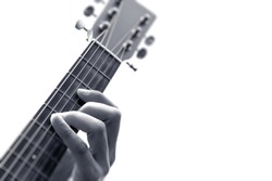 male musician hands playing guitar. black and white, isolated on white
