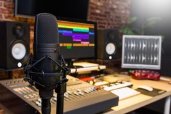 condenser microphone in digital sound editing & recording studio