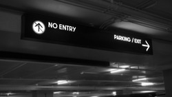 Digital parking signs with showed words no entry and parking ,exit in black and white picture.