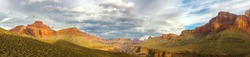 Wide Panoramic Landscape and Dramatic Cloudy Sky over Arizona Grand Canyon National Park from Great Hiking Trail on Tonto Plateau east of Hermit Creek