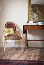 Stunning luxurious french chateau castle details in rural France, wooden floors and upholstered chair