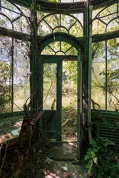 This is an interior view of a unique greenhouse /conservatory at the long abandoned and historic Dunnington Mansion in Farmville, Virginia.