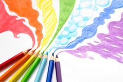 Pencils drawing rainbow smoke