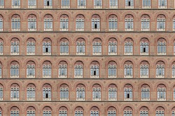 Texture of an old brick facade with antique windows