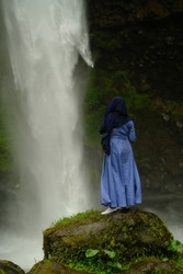 hijab women are enjoying splashing waterfalls
