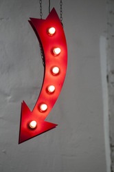 red arrow with light bulbs. signpost for your needs.