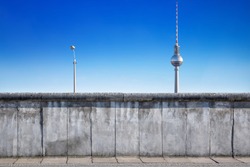 berlin wall against a blue sky