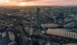 Manchester Cityscape at sunset. Entire city shown with Beetham Tower or the Hilton Hotel in the centre. Aerial view of Manchester city centre. Beautiful city skyline photograph at sunset.