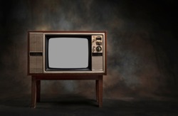 Retro old TV standing on a dark background