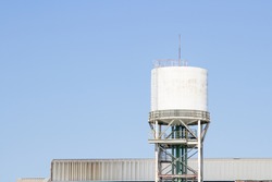 White water tower or water tank and blue sky