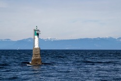 view of the sea, mountains and a navigational aid from Jack's Point in Nanaimo, British Columbia