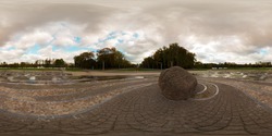 Full 360 degree equirectangula panorama in the park at the stone