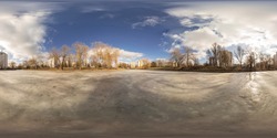 Full 360 degree equirectangula panorama on the frozen river in the city