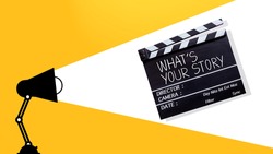 Storytelling concept.Handwriting on film slate or clapperboard. Cinema production of media industry concept. filmmaking equipment.